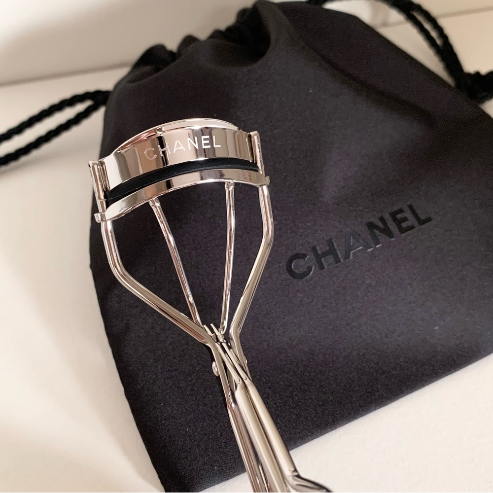 Hold NWOT Chanel eyelash curler with drawstring dust pouch